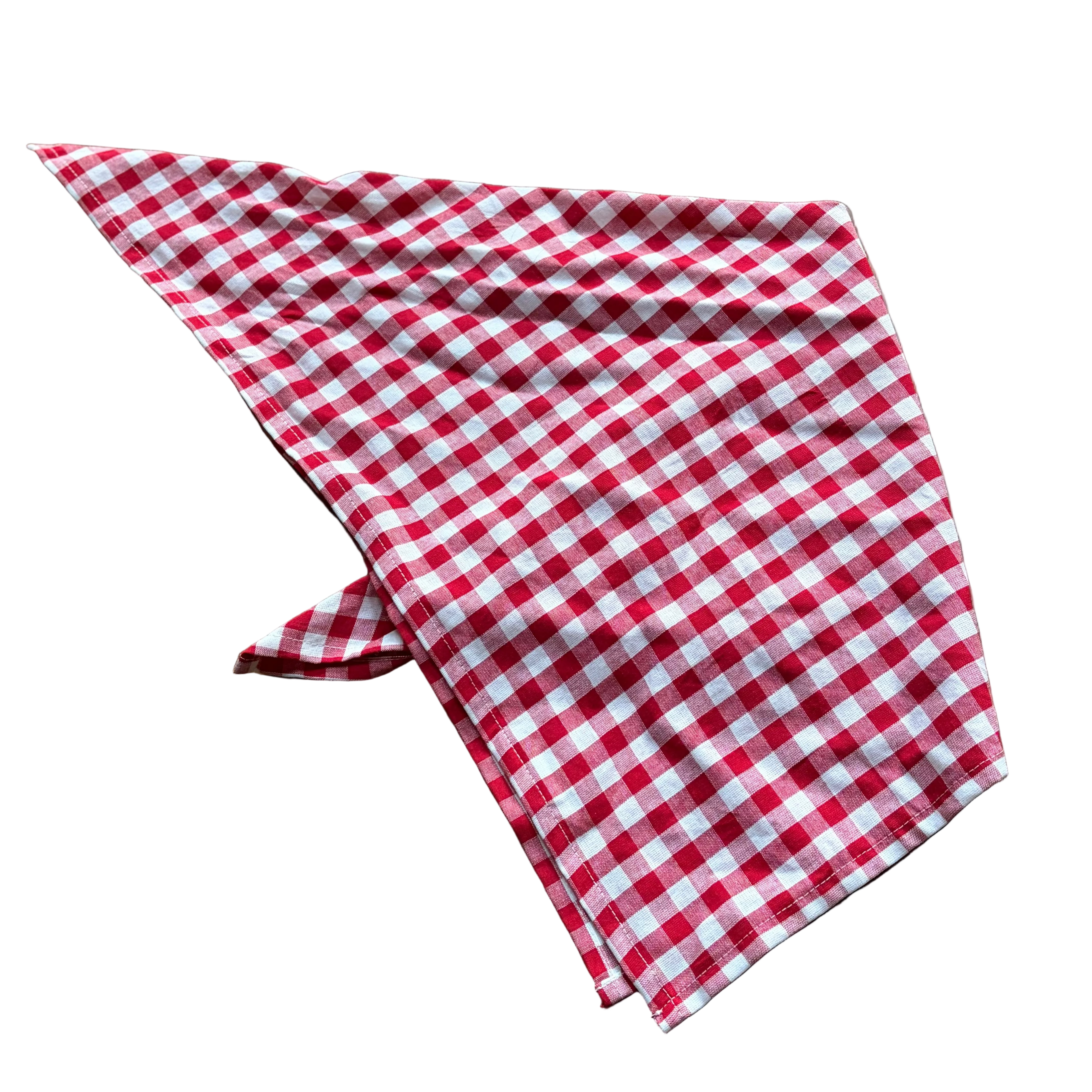 A red and white gingham checkered bandana or neck gaiter laid flat on a brown wooden surface.